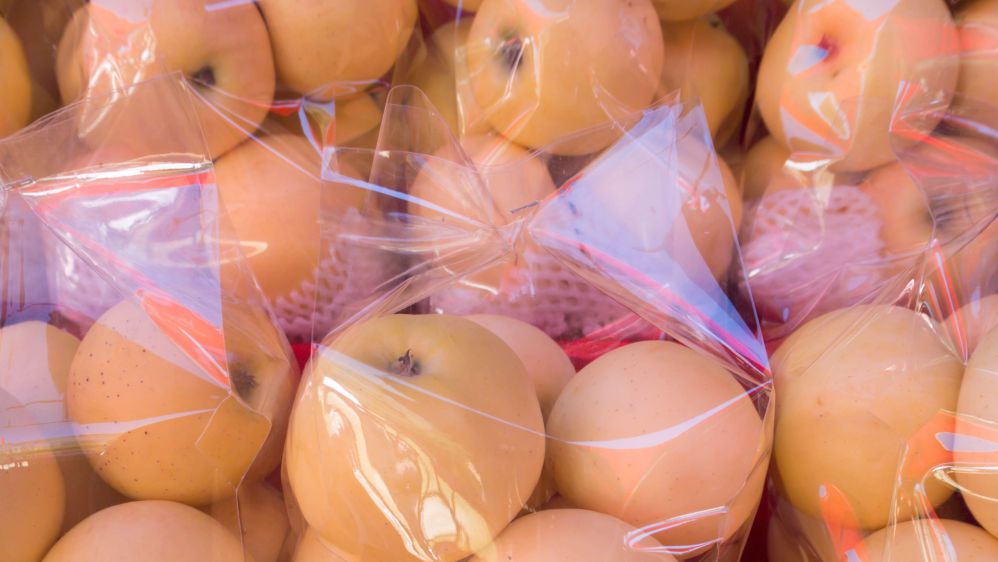 Yellow pear in plastic bag